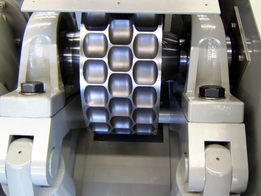 Roller mill for charcoal briquettes