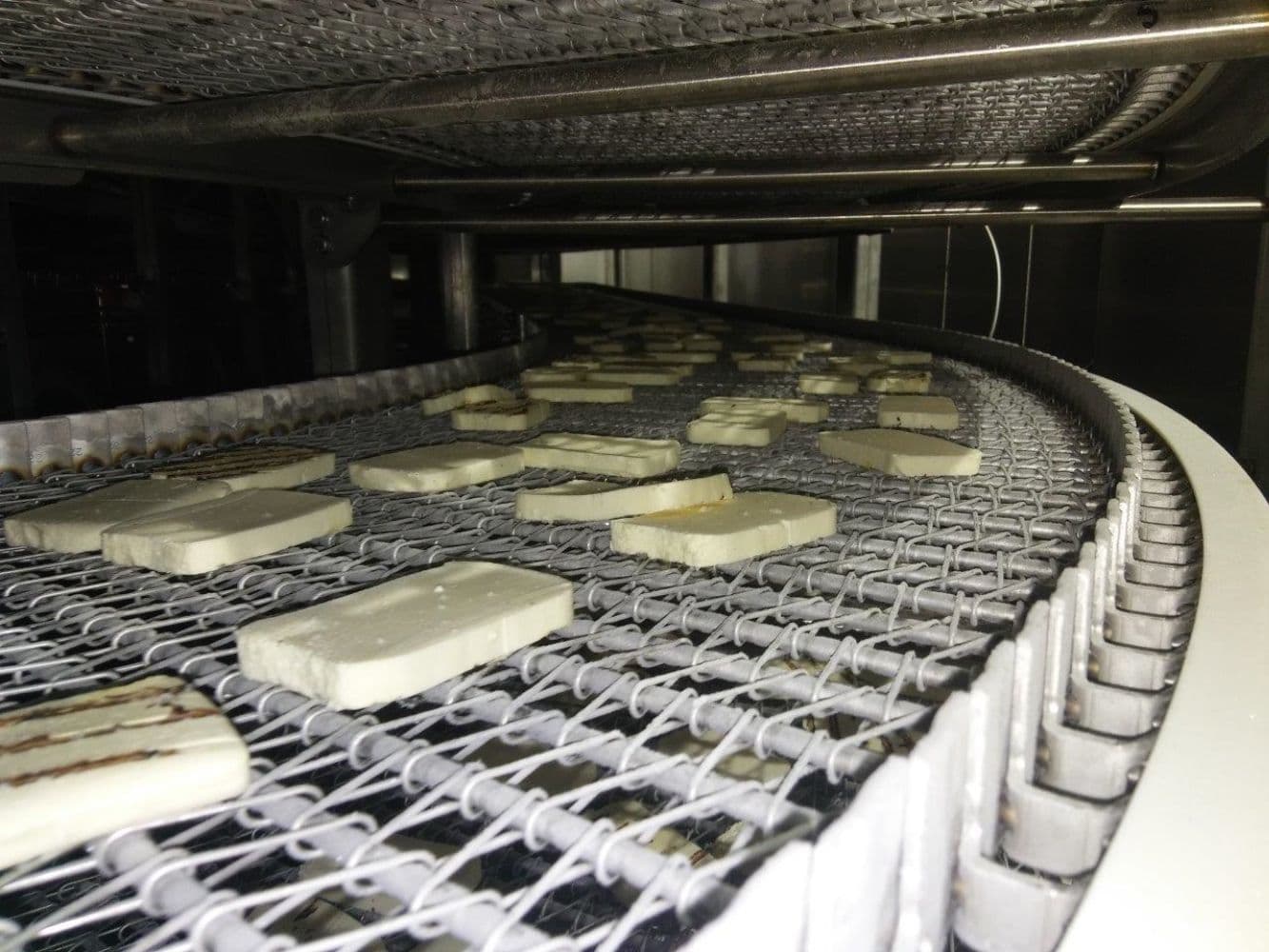 Conveyor Systems for Heat Treatment of Packaged Dairy Products